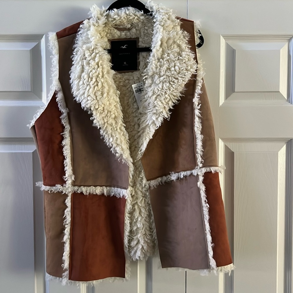 Fall into fall in this beautiful patchwork vest. New with tags size extra large.